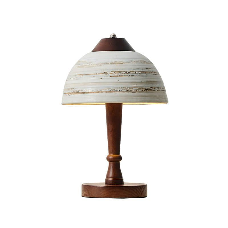 lampe de chevet bois flotté artisanal allumée sur un meuble